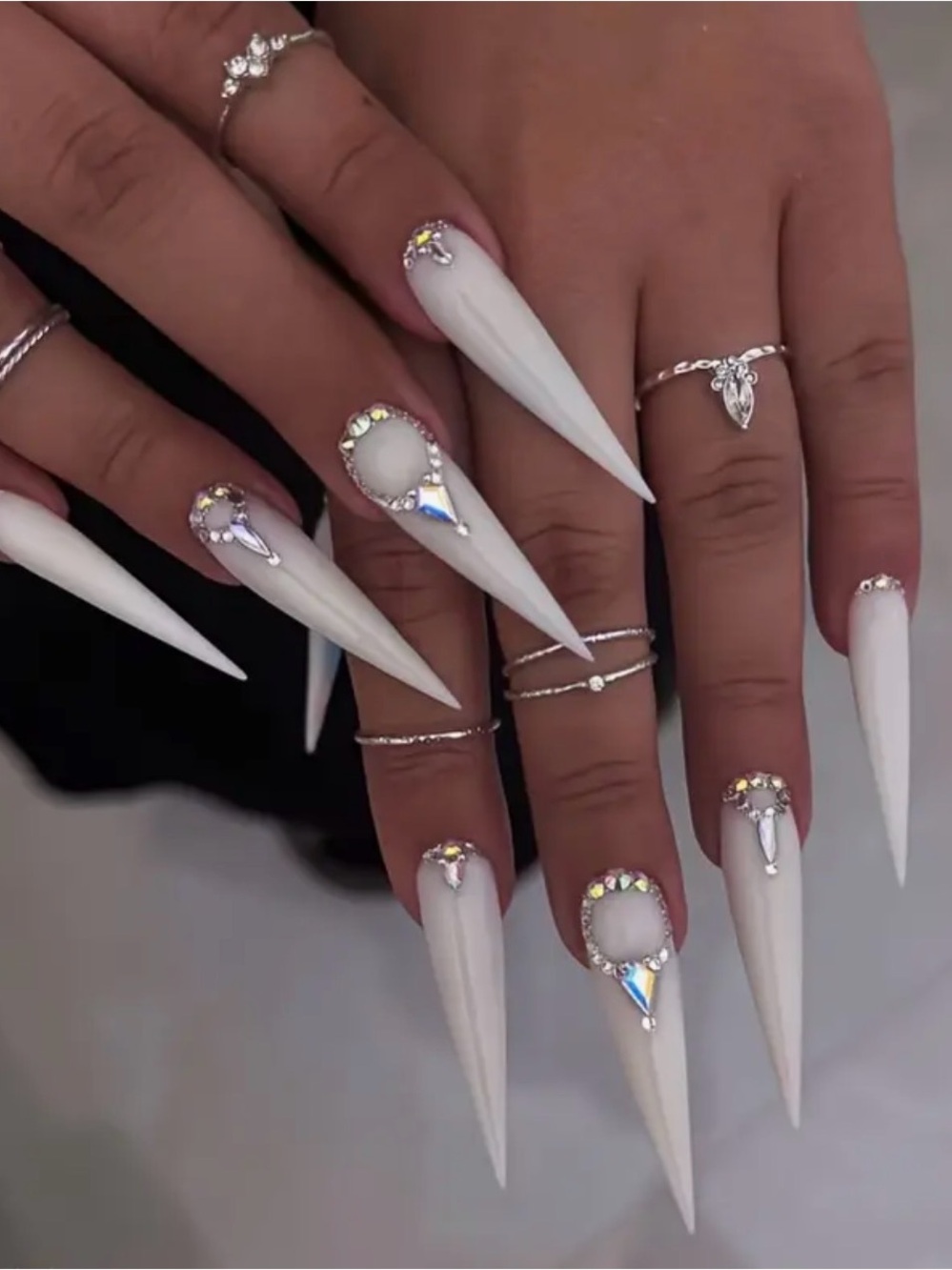 Long Stiletto White Acrylic Nails with Rhinestone Accent